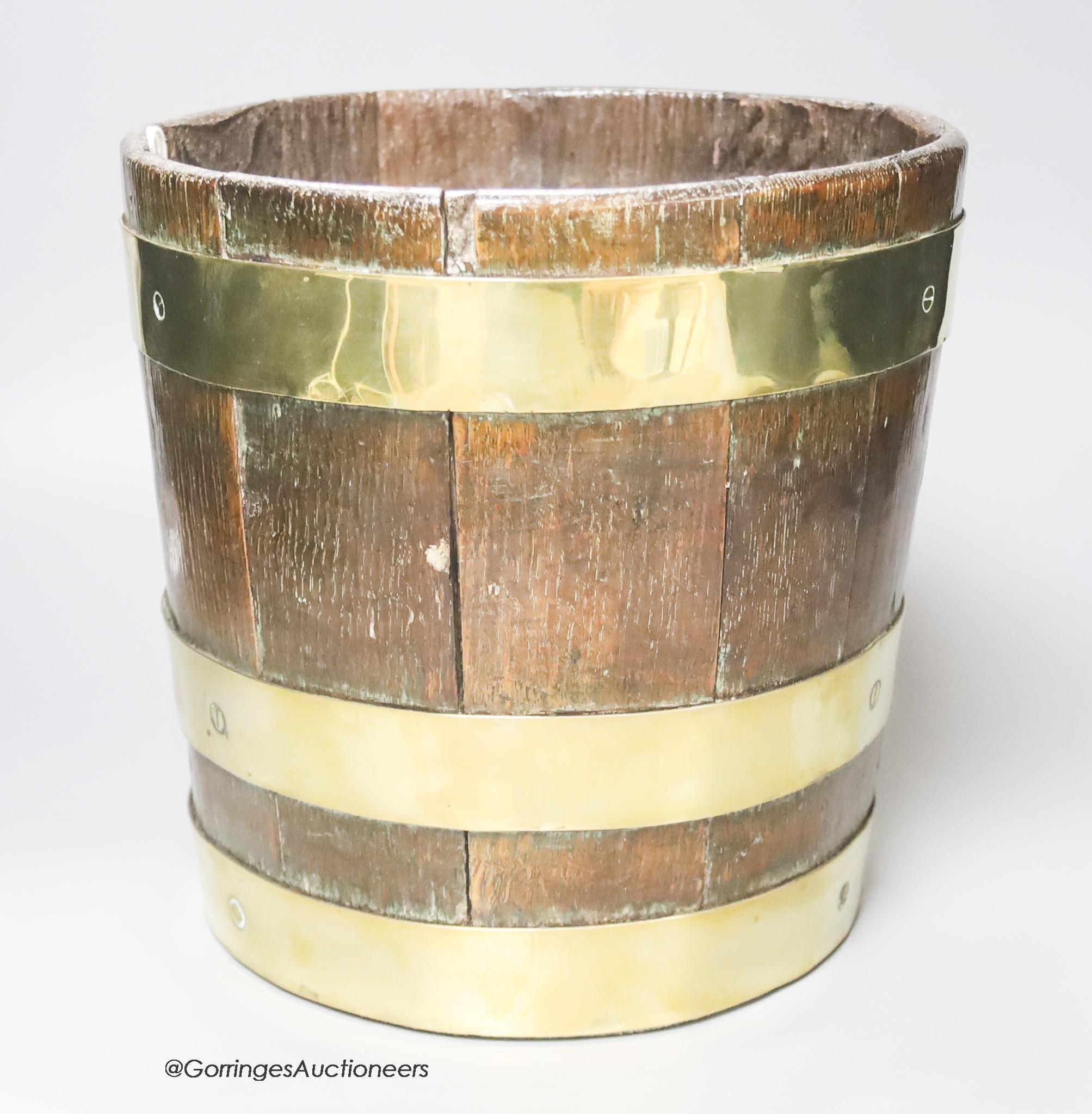 An 18th century brass-bound oak peat bucket, height 23cm